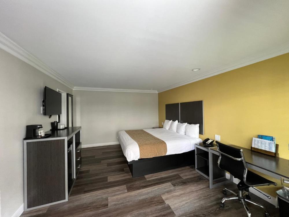 Spacious double queen room with large windows at Deluxe Inn Hawthorne/ LAX in Hawthorne, California